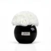 Luxury black ceramic vase with a refined cream lachaise label, showcasing pristine white roses in full bloom,