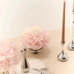 Elegant table with silver vase of pink and white roses