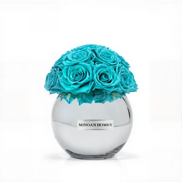 Clear glass Minoan Homey vase with turquoise artificial roses, minimalist flower arrangement